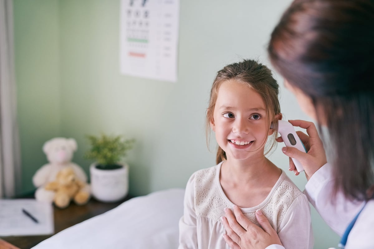 Cropped shot of a little girl having her ears examined by her pediatrician